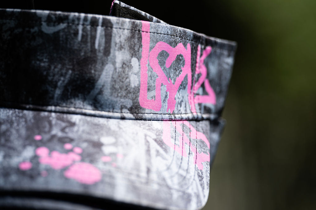 Modern Love Cap pink baseball cap with grey and black graffiti artwork